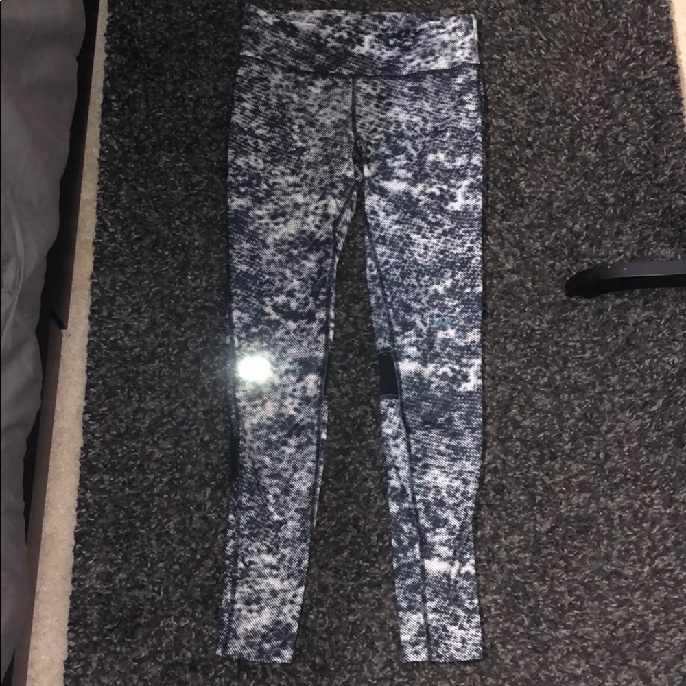 Black and white leggings with mesh on back of legs